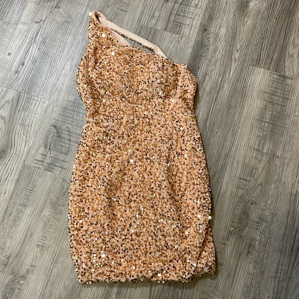 For fitting, one shoulder, sequin homecoming dress